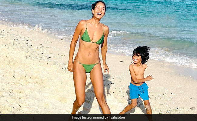Lisa Haydon's Chic Green Swim Set Is The Perfect Summer Uniform Under Bright Blue Skies