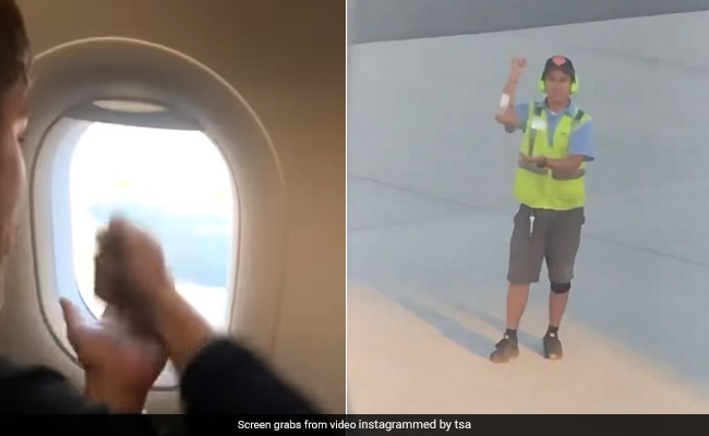 Watch: Flight Passenger Plays Rock-Paper-Scissors With Ground Staff Through Plane Window