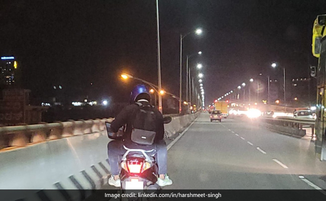 Pillion Rider Spotted Using Laptop On A Busy Flyover In Bangalore, Internet Divided