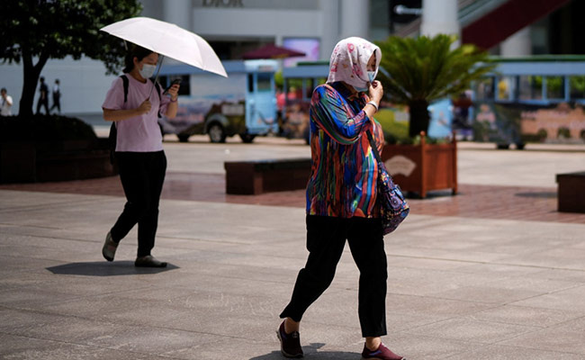 Dozens of Chinese Cities On Heatwave Alert As Roofs Melt, Roads Buckle