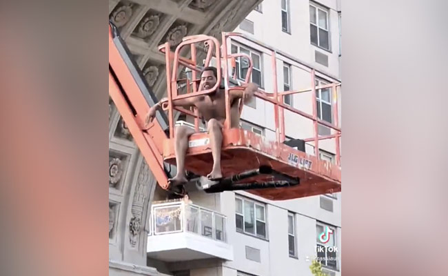 Man Strips On Crane, Asks Crowd "Are You Not Entertained?"