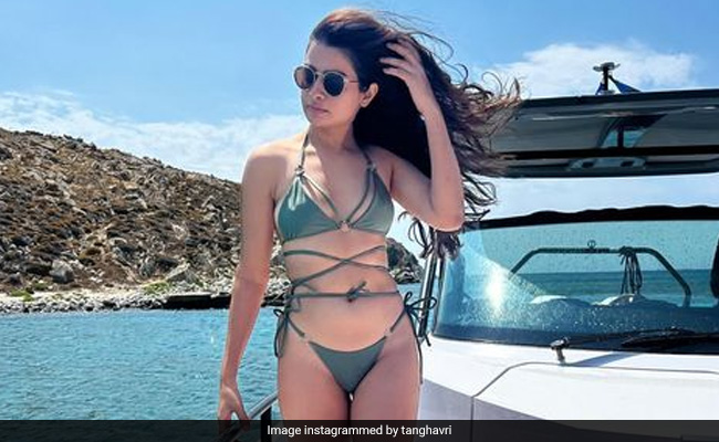 Tanya Ghavri Takes A Break From Styling Celebs To Get Her Tan On In A Slinky Green Swimsuit