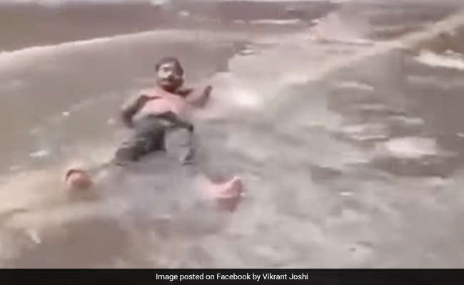 Mumbai Man Lies On Waterlogged Road, Internet Says "Maldives In Malad"