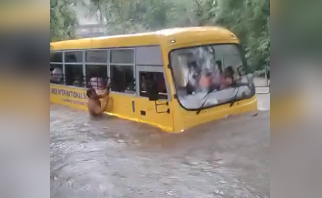 Video: School Bus With 2 Dozen Children Stuck In Drain, Pulled Out