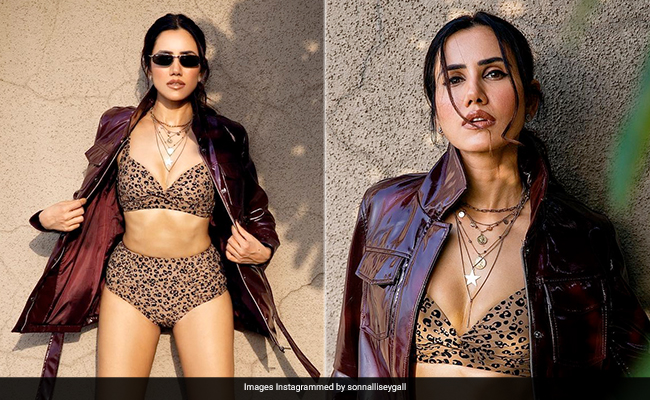 Sonnalli Seygall Layers Up Brilliantly In A Printed Bikini And A Leather Jacket