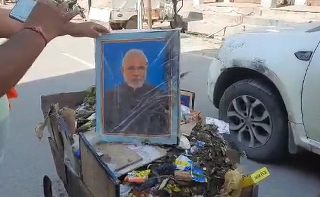Video: UP Man Sacked Over PM, Yogi Adityanath Pics In Garbage Cart