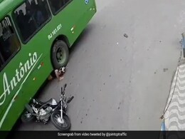 Watch: Narrow Escape For Biker Who Goes Under Bus Watch: Narrow Escape For Biker Who Goes Under Bus