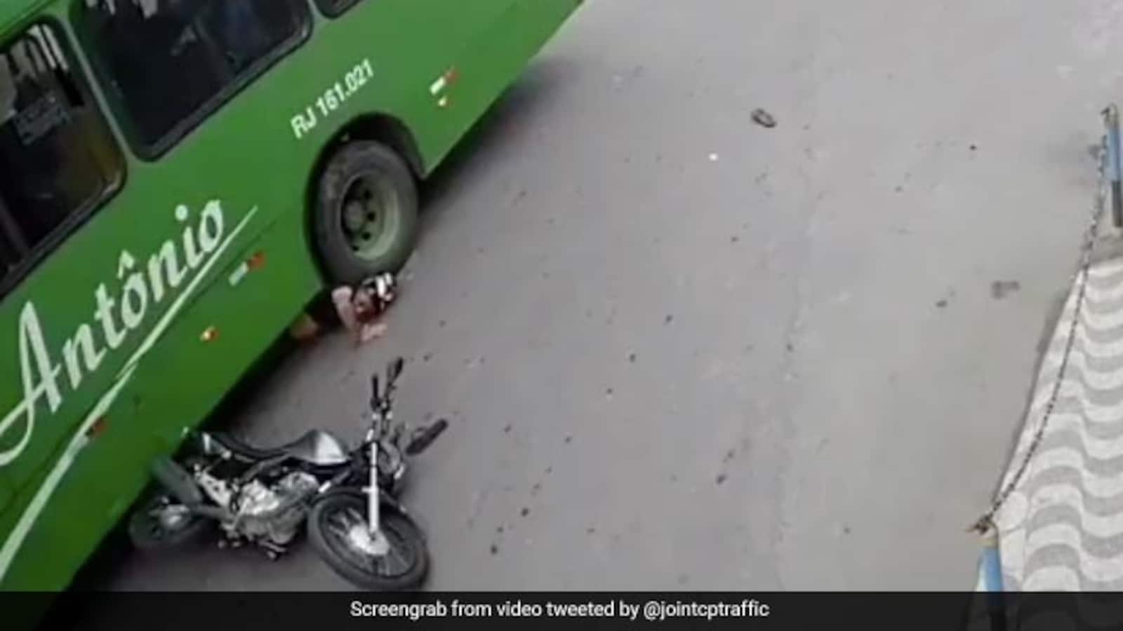Watch: Narrow Escape For Biker Who Goes Under Bus