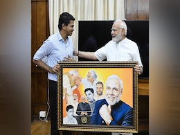 Specially-Abled Artist From Assam Meets PM Modi, Gives Him A Special Gift Specially-Abled Artist From Assam Meets PM Modi, Gives Him A Special Gift