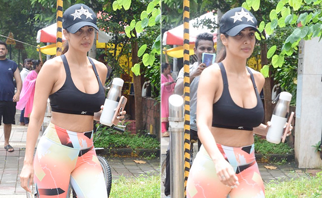 Malaika Arora In A Black Sports Bra And Colourful Printed Tights Is Serving A Sporty Pop Of Colour