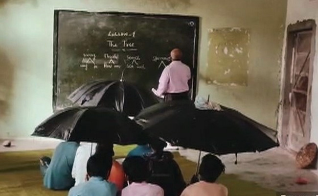 Video: Students Hold Umbrellas As Roof Leaks In Madhya Pradesh School