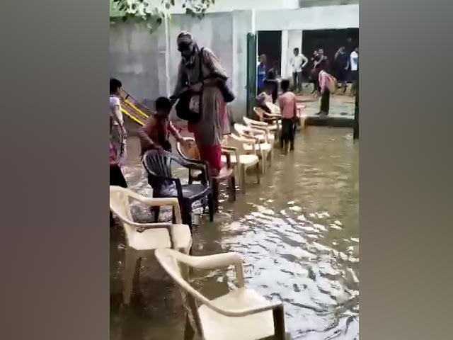Viral Video Shows Teacher Entering Flooded School, Students Hold Chairs