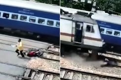 Watch: Man Abandoned Bike, Ran As Train Approached, Narrow Escape Watch: Man Abandoned Bike, Ran As Train Approached, Narrow Escape