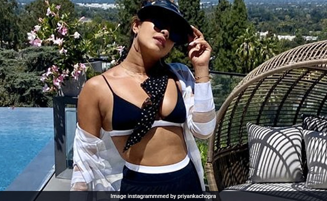Priyanka Chopra's "Sundaze" Look Sporty Chic In A Black Bralette And Matching Cycling Shorts