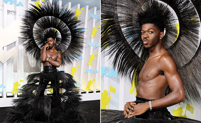 Lil Nas X Turns Heads With His Feathered Headdress And Black Circular Skirt On The Black Carpet