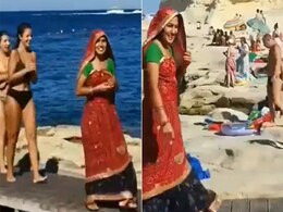 Bikini में घूम रहीं विदेशी लड़कियों के बीच अचानक लहंगा चुन्नी में पहुंच गई महिला, देखें रिएक्शन Bikini में घूम रहीं विदेशी लड़कियों के बीच अचानक लहंगा चुन्नी में पहुंच गई महिला, देखें रिएक्शन