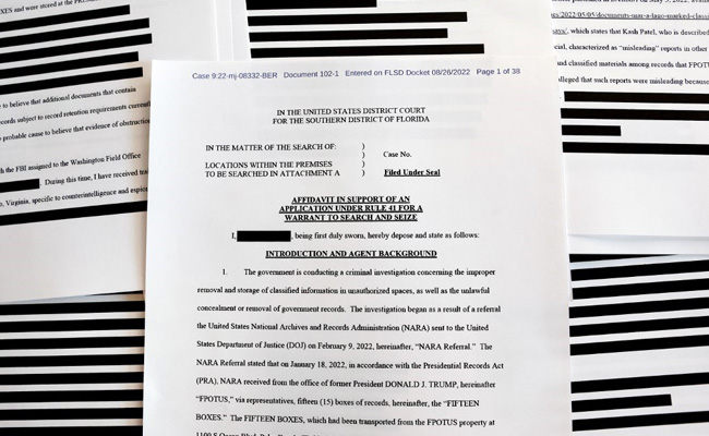 Photo Of Secret Documents Piled On Trump Carpet