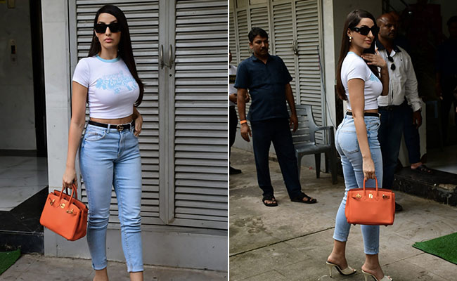 Nora Fatehi Colourblocks Her Way In A White Tee, Blue Jeans And A Fiery Orange Rs 8 Lakh Hermes Birkin Handbag