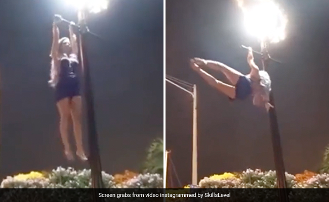 Watch: Woman Performing Gymnastic Tricks On Lamp Post Leaves Internet Amazed