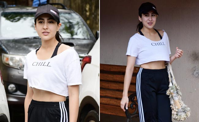 Sara Ali Khan Is Effortlessly Cool In A White Crop Top, Striped Track Pants And Tote