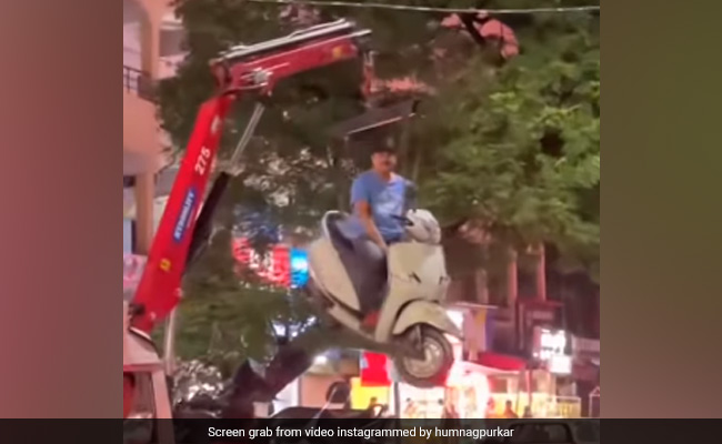 "Airlift Part 2.0": Man Sits On Scooter As It Hangs In Air While Getting Towed