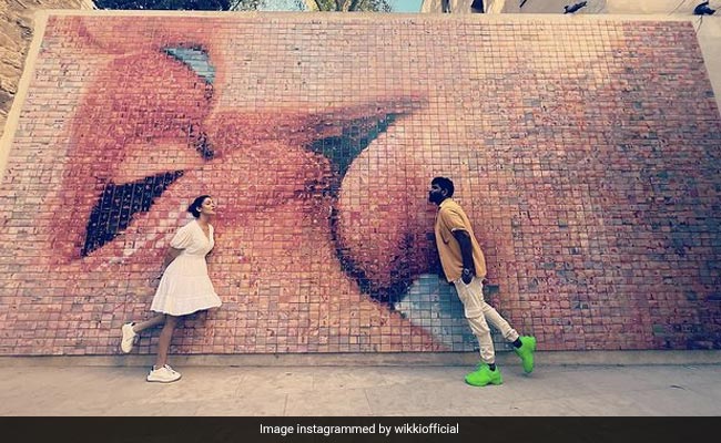 Nayanthara And Vignesh Shivan Pose At The Kiss Wall In Barcelona. See Cute Pics