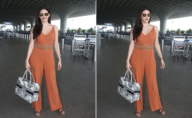 Amyra Dastur's Orange Jumpsuit And Christian Dior Book Tote Makes Travel Style Chic As Ever