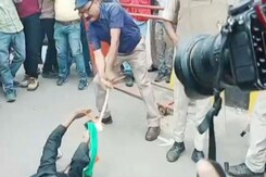 Video: Bihar Bureaucrat Thrashes, Drags Job Aspirant Holding National Flag Video: Bihar Bureaucrat Thrashes, Drags Job Aspirant Holding National Flag