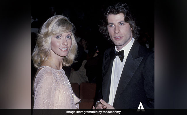 To Olivia Newton-John, From <i>Grease</i> Co-Star John Travolta: "We Will All Be Together Again"