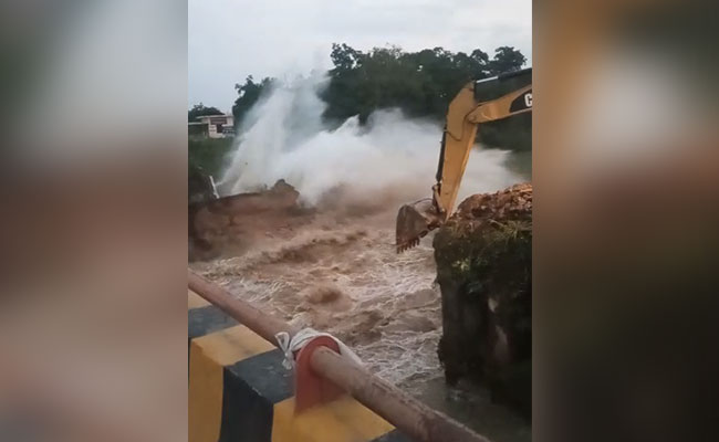 Watch: Bridge Demolished, Bulldozer Crashes Into Water Too. Driver Escapes