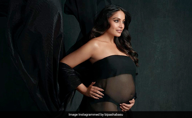 Mom-To-Be Bipasha Basu Showcases Her "Magical Feelings" And Baby Bump In A Sheer Black Flowing Dress