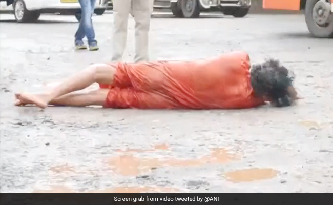 Watch: Karnataka Man Rolls On Road To protest Against Potholes