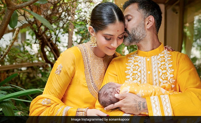 In Matching Yellow Ethnic Ensembles, Sonam Kapoor And Anand Ahuja Introduce Their Son Vayu Kapoor Ahuja To The World