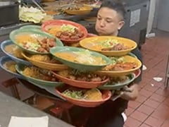 Viral: Server Picks Up Dozens Of Plates Effortlessly; Internet Reacts Viral: Server Picks Up Dozens Of Plates Effortlessly; Internet Reacts