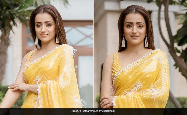 Sunshine Strokes Trisha Krishnan's Yellow Sequinned Saree Ahead Of <i>Ponniyin Selvan: 1</i> Release