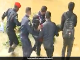 Video: Bengaluru Man Rescued From Flooded Road By Security Guards Video: Bengaluru Man Rescued From Flooded Road By Security Guards