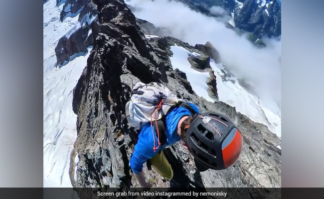 This Video Of A Man Walking On Extremely Thin Mountain Ridge Will Leave You Terrified