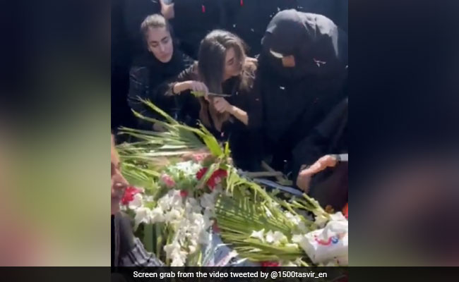 Video: Woman Chops Hair On Grave Of Brother Killed In Anti-Hijab Protest