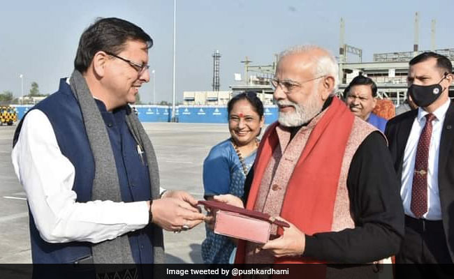 Uttarkhand Chief Minister Gifts PM Traditional Cap Carved With Brahma Kamal