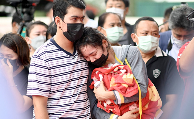 Day After Mass Shooting, Weeping Families Gather Outside Thai Nursery