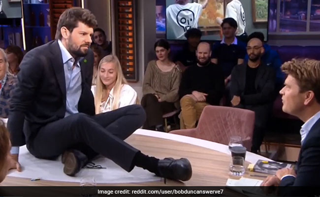 Video: Climate Activist Glues Himself To Table During Talk Show