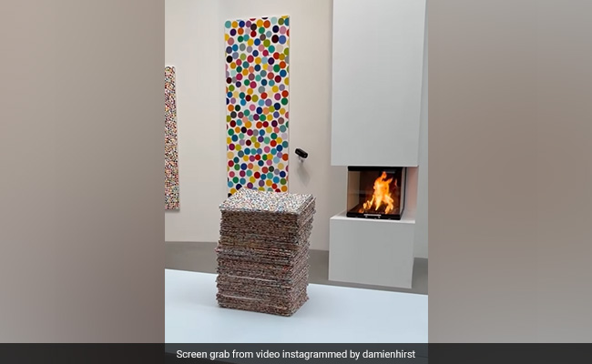 Artist Damien Hirst Sets Thousands Of His Paintings On Fire On Instagram Live. Here's Why