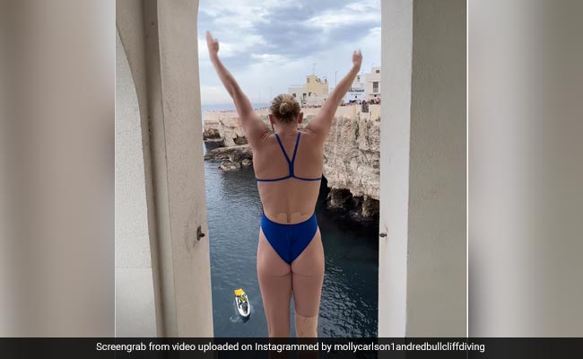 Watch: Professional High-Diver Jumps From An Italian Cliff Balcony