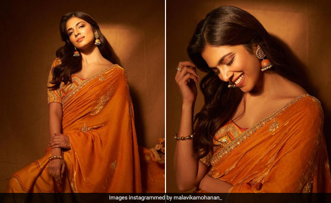 We Can't Decide What We Adore More; Malavika Mohanan's Festive Glow Or Her Radiant Orange Saree