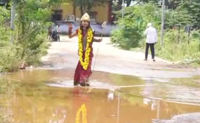 Watch: Girl, Dressed As Goddess Durga, Walks On Potholed Road