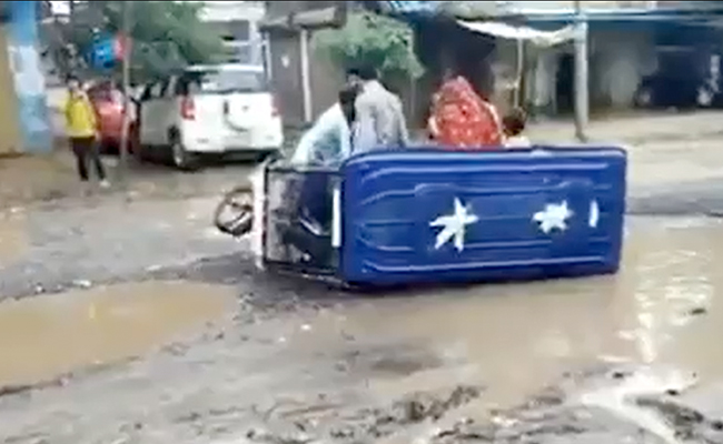 Watch: E-Rickshaw Overturned On Potholed Road, UP Officials Didn't Stop