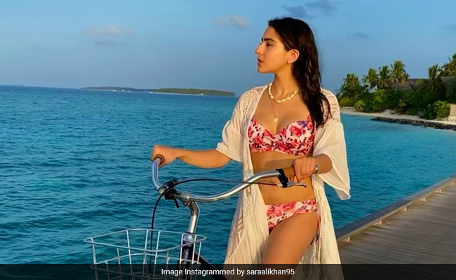 Sara Ali Khan's Days By The Sea Are Spent Cycling By In A Floral Swimsuit