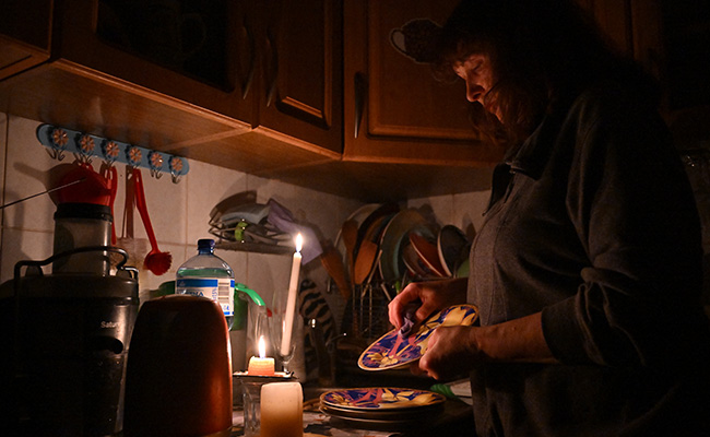 Defiance By Candlelight As Ukraine Adapts To Blackouts Amid War
