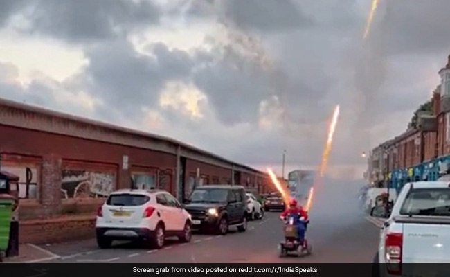 Watch: Man Dressed As Mario Rides A Scooter Which Shoots Fireworks
