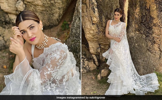 All The Lace And Ruffles Land Right On Kriti Sanon's Very Elegant White Saree